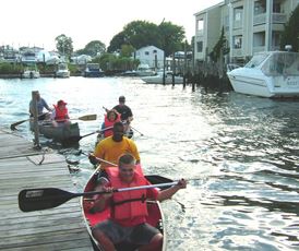 Several canoes maneuvering